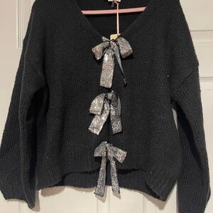 Elegant Black Sweater with Glitter Bows